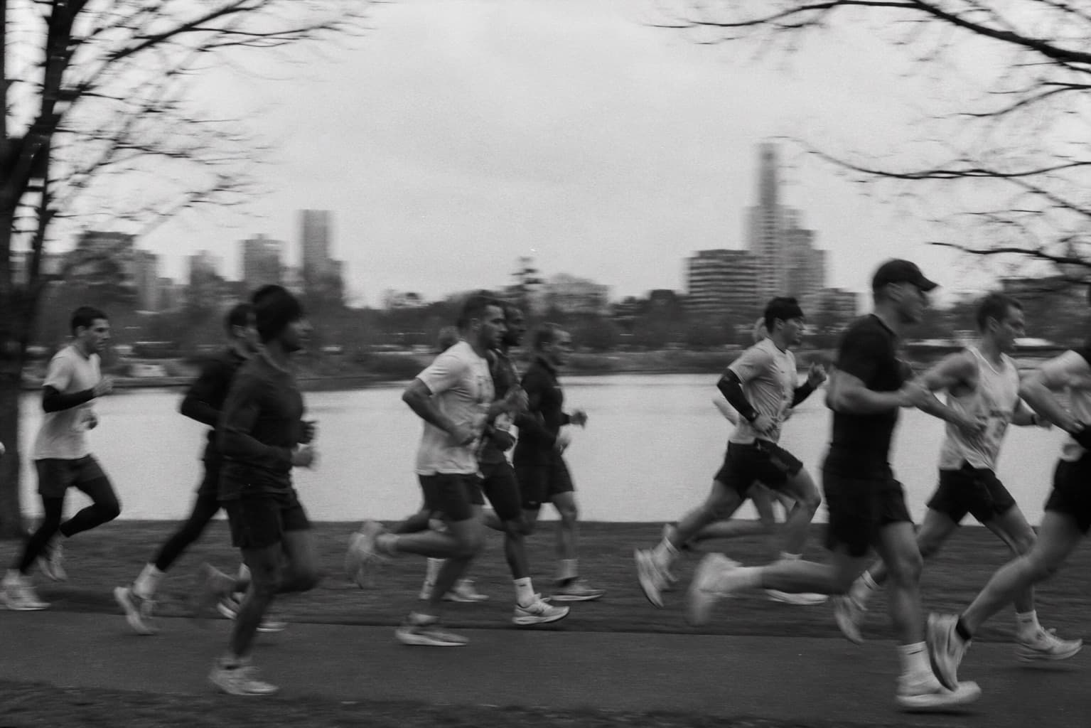 A pack of runners along the riverside